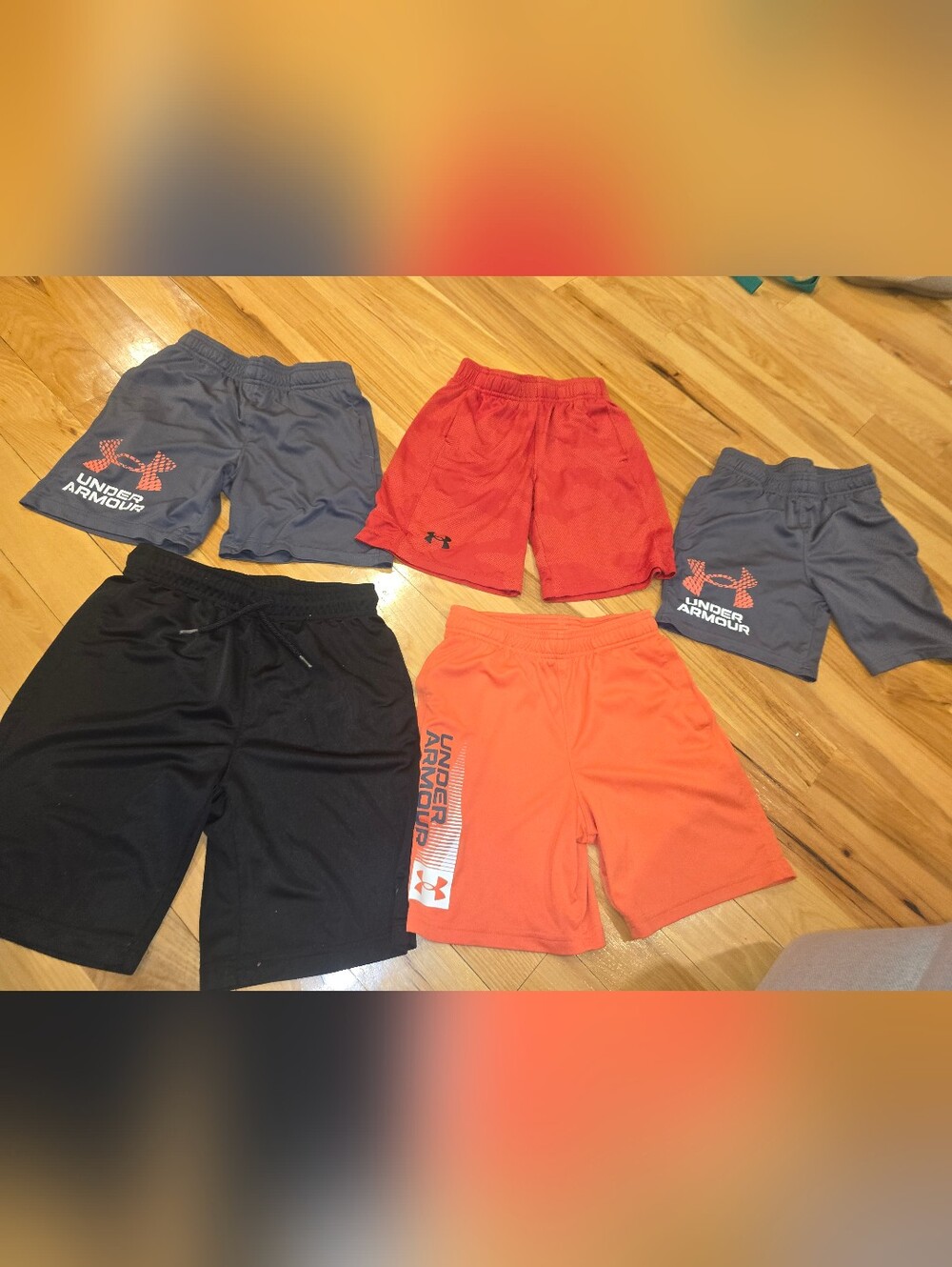 5 boys athletic shorts,  mostly under armour, size small and medium